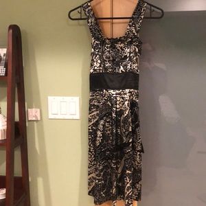 Black and white printed dress with a black tie